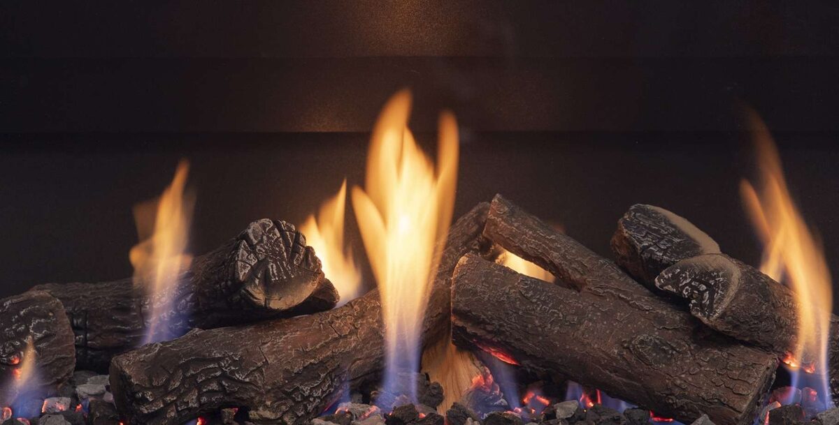 Close-up of tall flames rising between ceramic logs in the DFS740 firebox
