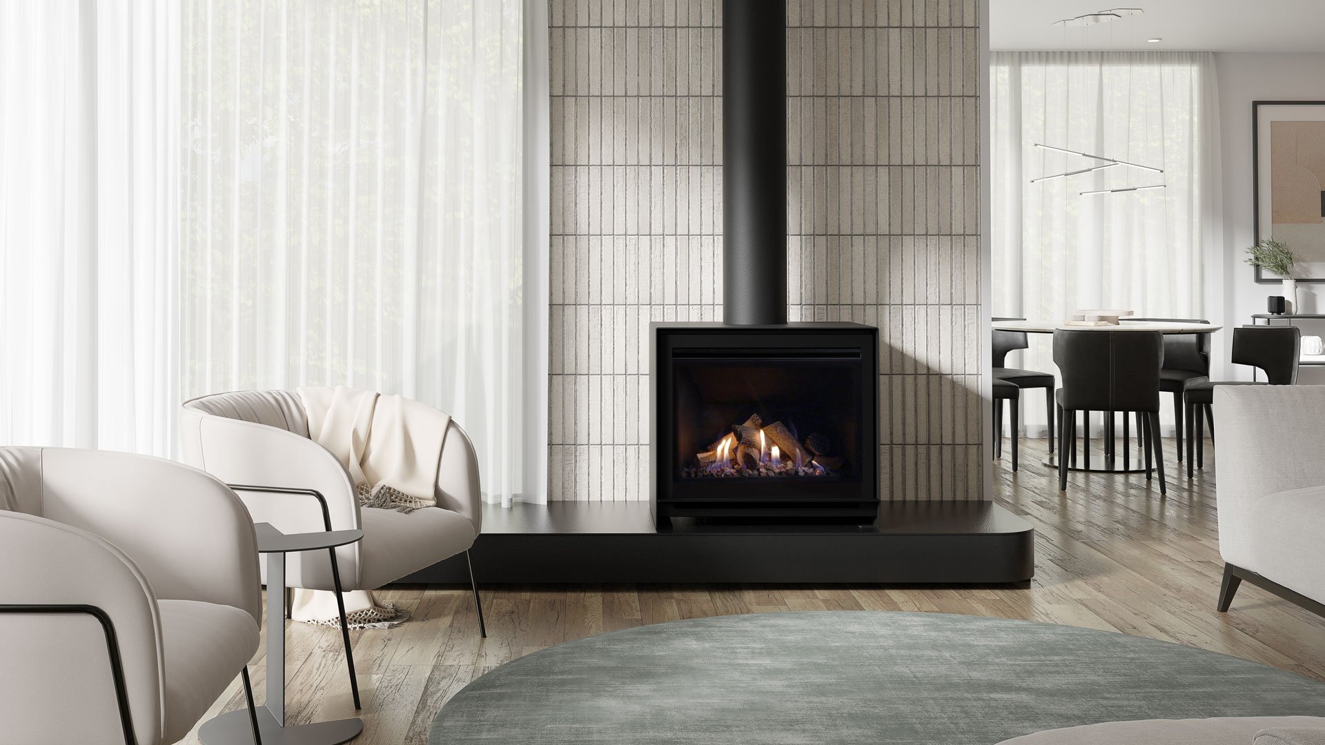 Escea DFS740 freestanding gas fireplace on a black plinth against a white tiled wall in a living room